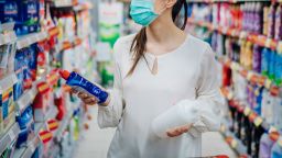 Woman wearing protective mask preparing for virus pandemic spread quarantine.