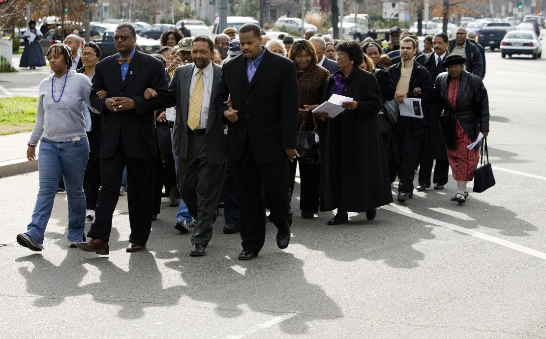 A group marches from the Tenth Street Baptist Church to the African-American Civil War Memorial January 15, 2007 in Washington to observe the birthday of Dr. Martin Luther King Jr.  Some Black churchgoers are socially conservative and open to voting for Republican candidates.