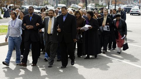 A group marches from the Tenth Street Baptist Church to the African-American Civil War Memorial January 15, 2007 in Washington to observe the birthday of Dr. Martin Luther King Jr.  Some Black churchgoers are socially conservative and open to voting for Republican candidates.