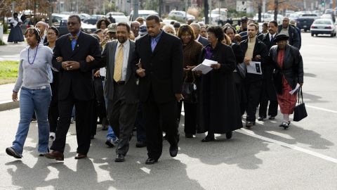 A group marches from the Tenth Street Baptist Church to the African-American Civil War Memorial January 15, 2007 in Washington to observe the birthday of Dr. Martin Luther King Jr. Some Black churchgoers are socially conservative and open to voting for Republican candidates.