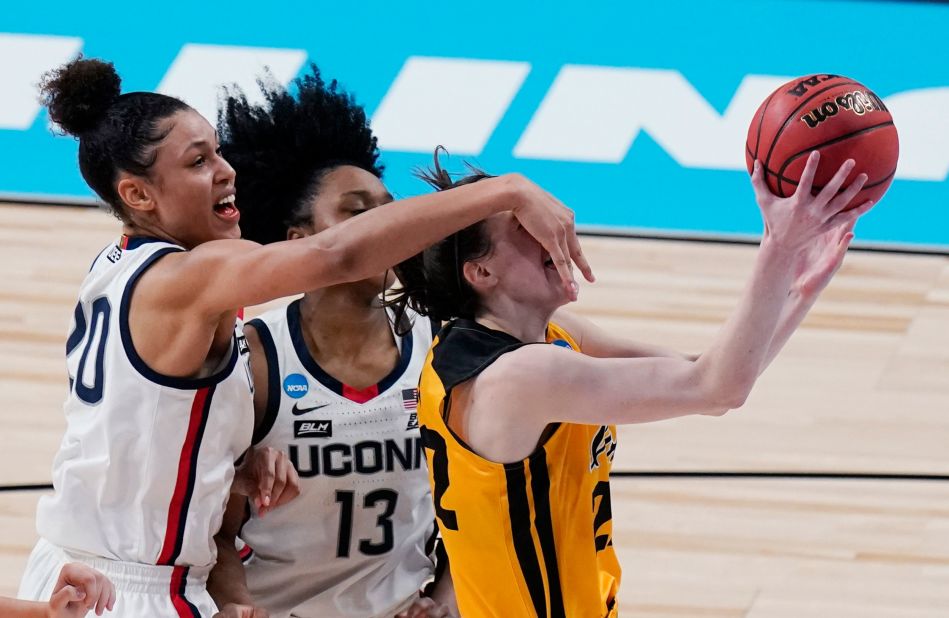 Iowa guard Caitlin Clark is fouled by Connecticut's Olivia Nelson-Ododa.