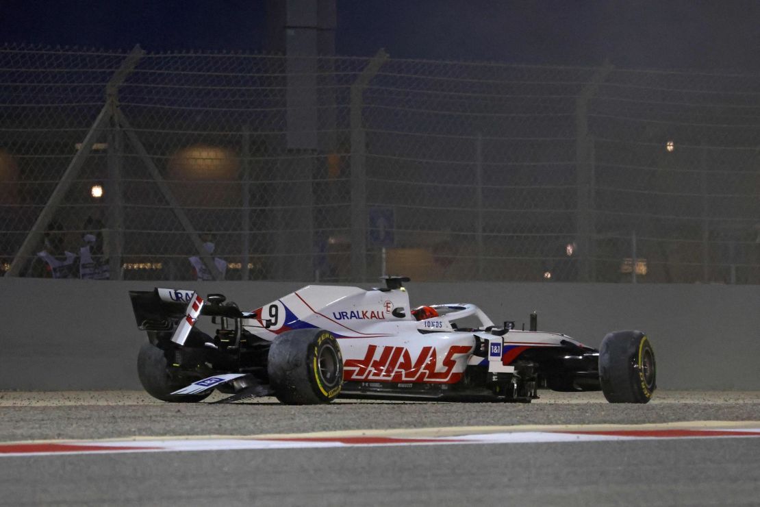 Haas F1's Russian driver Nikita Mazepin sits in his damaged car after crashing out during the Bahrain Grand Prix.