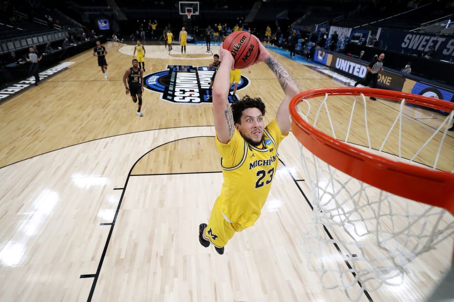 Michigan's Brandon Johns Jr. throws down a dunk during a Sweet Sixteen win against Florida State.