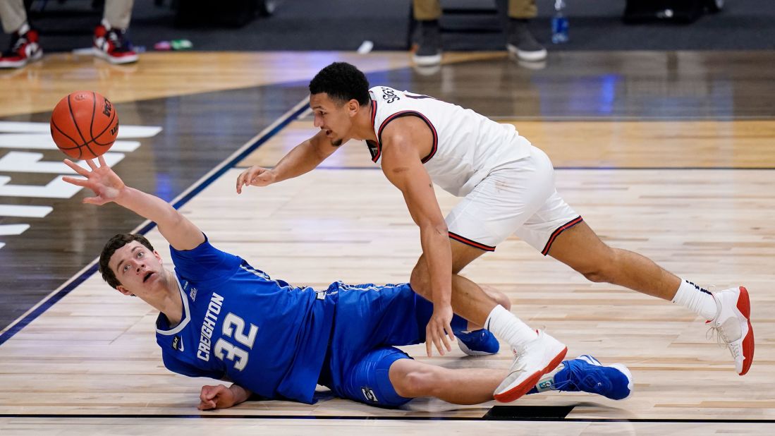 Creighton center Ryan Kalkbrenner, left, and Gonzaga guard Jalen Suggs reach for a loose ball on March 28.