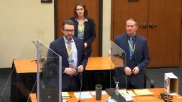 In this image taken from video, defense attorney Eric Nelson, left, defendant former Minneapolis police officer Derek Chauvin, right, and Nelson's assistant Amy Voss, back, introduce themselves to jurors as Hennepin County Judge Peter Cahill presides over jury selection in the trial of Chauvin, Monday, March 22, 2021, at the Hennepin County Courthouse in Minneapolis. Chauvin is charged in the May 25, 2020, death of George Floyd. (Court TV via AP, Pool)