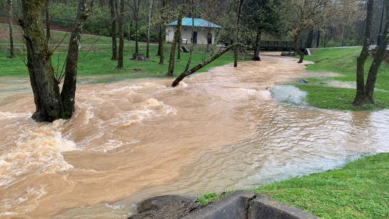 The north fork of Turkey Creek overflows its banks in Farragut, Tennessee, on Sunday, March 28.