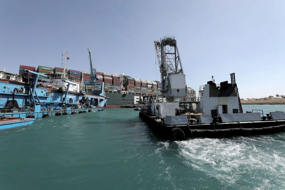 A tugboat operates on the Ever Given on Sunday.