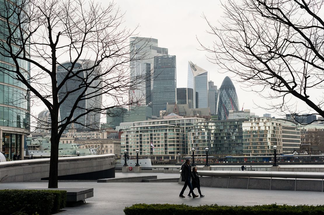 People walk on empty street in London's popular South Bank district last Wednesday.