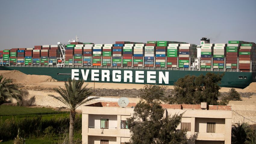 SUEZ, EGYPT - MARCH 29: The container ship 'Ever Given' is refloated, unblocking the Suez Canal on March 29, 2021 in Suez, Egypt. This morning the container ship came partly unstuck from the shoreline, where it ran aground in the canal last Tuesday, and later resumed its course shortly after 3pm local time. The Suez Canal is one of the world's busiest shipping lanes and the blockage had created a backlog of vessels at either end, raising concerns over the impact on global shipping and supply chains. (Photo by Mahmoud Khaled/Getty Images)