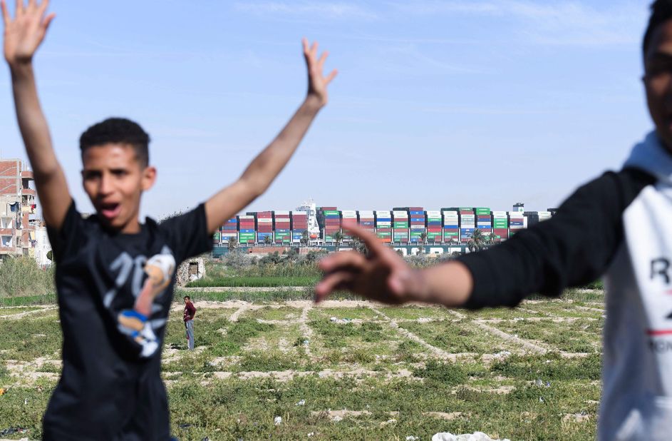 Children celebrate after the Ever Given container ship was freed in the Suez Canal on Monday, March 29.