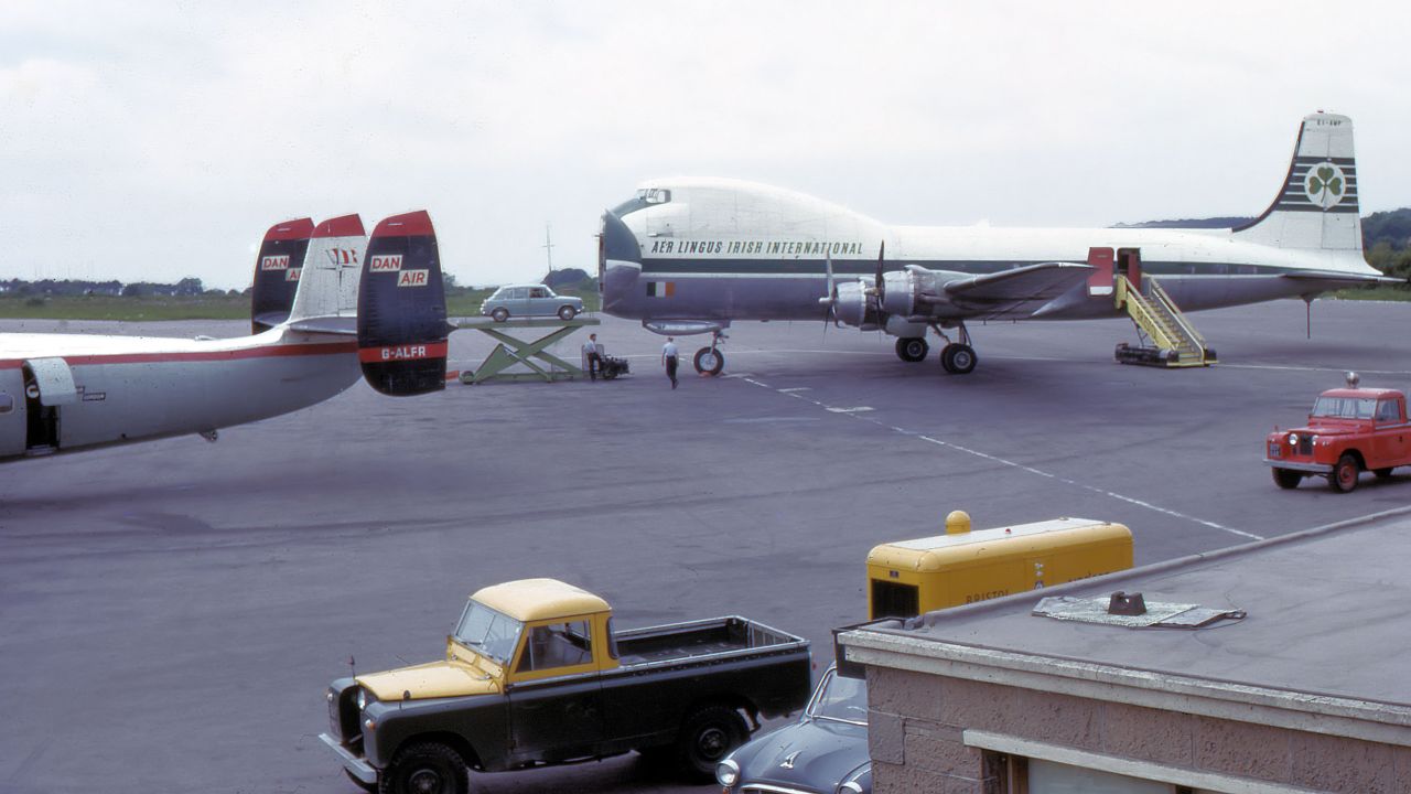 A car is loaded onto an Aer Lingus  Aviation Traders ATL-98 Carvair at Bristol Airport in the UK. 