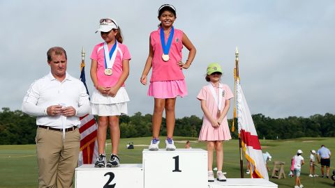 Pano stands atop the podium after winning the Regional Finals Girls 7-9 section of the Drive, Chip and Putt competition.