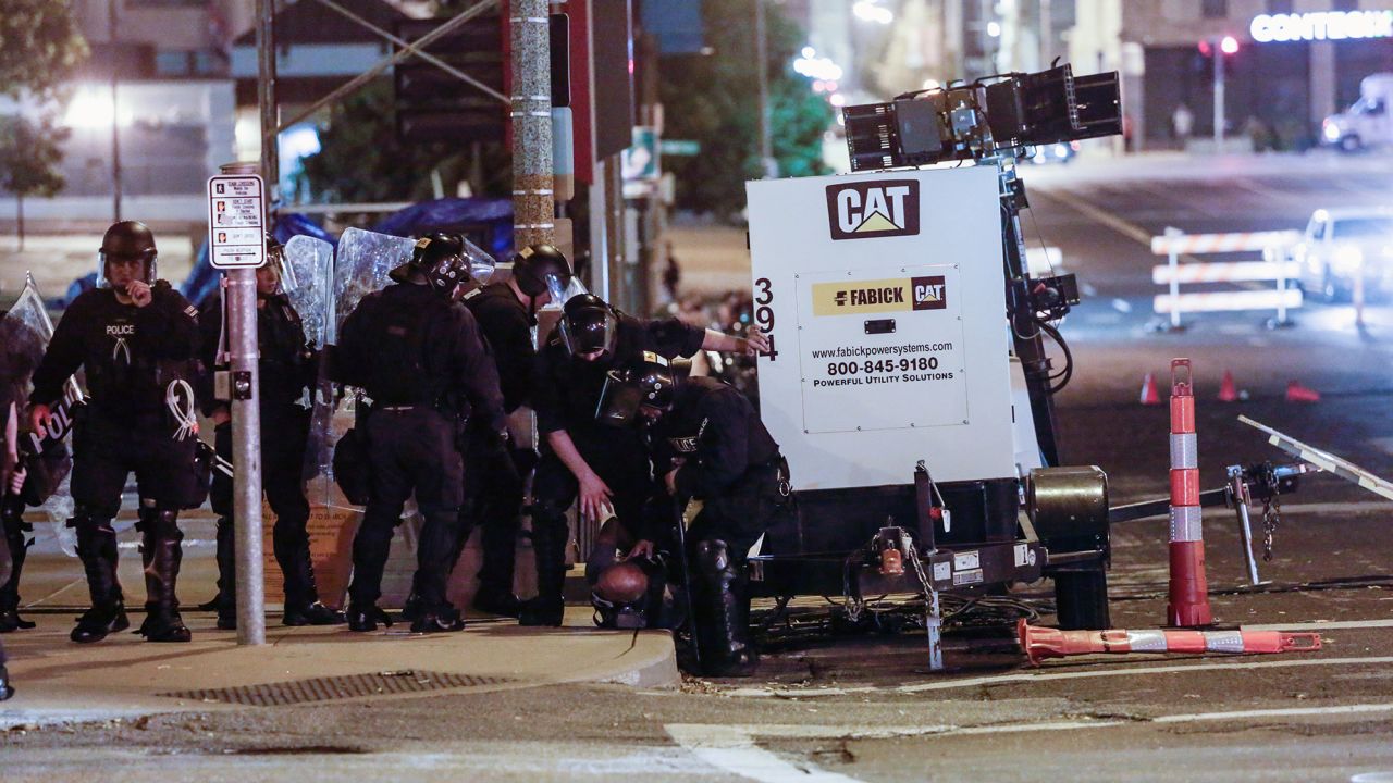 Members of the St. Louis Police Department detain Luther Hall during racial injustice protests in St. Louis, Missouri, on September 17, 2017.