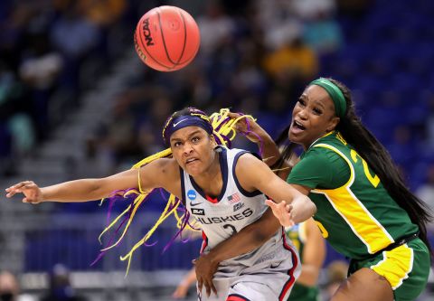 Connecticut's Aaliyah Edwards, left, and Baylor's Queen Egbo eye a loose ball on Monday.