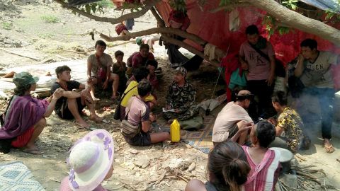 Ethnic Karen villagers fleeing from air attacks by Myanmar military take rest in a jungle after crossing the Myanmar-Thai border in Mae Hong Son province, Thailand, on March 28.