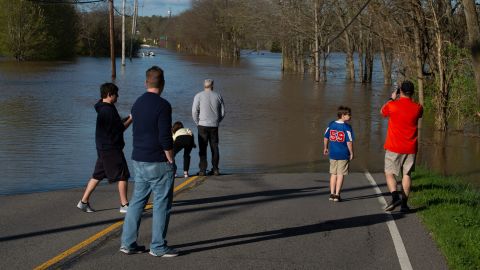 Bellevue residents survey flooding from the Harpeth River Sunday.