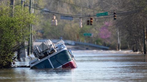A Nashville Fire truck is revealed as flood waters from the Harpeth River recede along Old Harding Pike near Morton Mill Rd. in Nashville, Tennessee Monday.