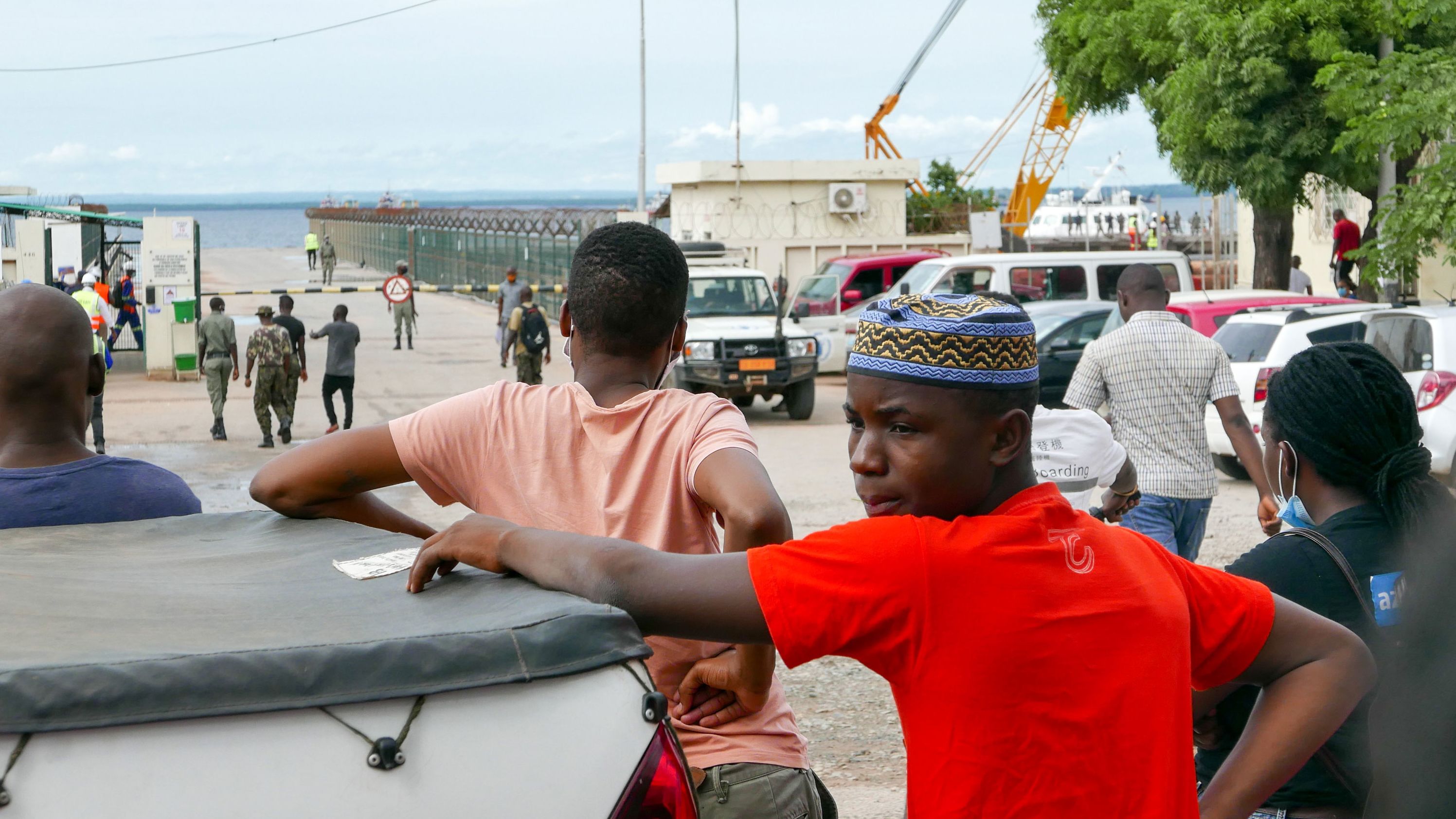 People in Pemba, Mozambique await the arrival of more ships from Palma as people flee attacks by rebel groups on March 29.