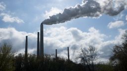 Emissions rise from a smoke stack at the Conesville Power Plant in Conesville, Ohio, U.S., on Saturday, April 18, 2020. The Trump administration on Thursday attacked the legal basis of requirements to capture mercury and other heavy metal pollution from power plants, setting the stage for a court to potentially toss out the mandates altogether. Photographer: Dane Rhys/Bloomberg via Getty Images