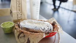 A chicken burrito, guacamole, bag of tortilla chips, and a drink are arranged for a photograph at a Chipotle Mexican Grill Inc. restaurant in El Segundo, California, U.S., on Wednesday, July 25, 2018. Chipotle is scheduled to release earnings figures on July 26. Photographer: Patrick T. Fallon/Bloomberg via Getty Images