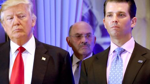 US President-elect Donald Trump along with his son Donald, Jr., arrive for a press conference at Trump Tower in New York, as Allen Weisselberg (C), chief financial officer of The Trump, looks on January 11, 2017.