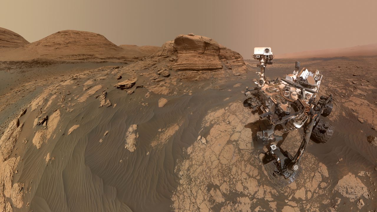NASA's Curiosity rover used two cameras to create this selfie in front of "Mont Mercou," a rock formation that stands 20 feet tall.