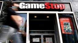 A man passes by GameStop at 6th Avenue on March 23, 2021 in New York. GameStop stocks falls more than 10% after the video game store showing  strong earnings but lower than expected. (Photo by John Smith/VIEWpress)