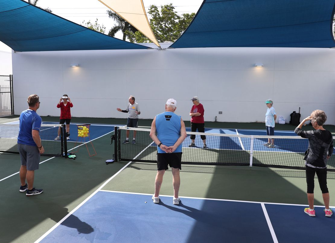 Bob Savar (third left) teaches a pickleball class at a retirement community in Pompano Beach, Florida. 