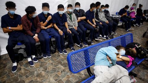 Young unaccompanied migrants, wait for their turn at the secondary processing station inside the Donna Department of Homeland Security holding facility, the main detention center for unaccompanied children in the Rio Grande Valley in Donna, Texas on March 30, 2021. CNN has blurred faces to protect individuals' identities.