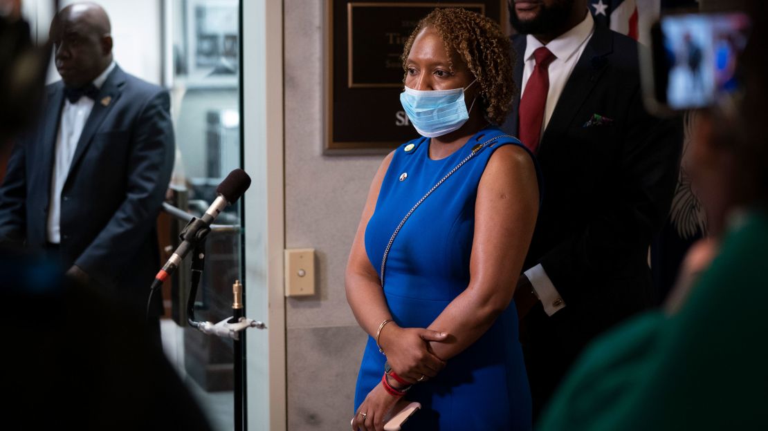 Alissa Charles-Findley, sister of the late Botham Jean, and civil rights attorney Lee Merritt speak to reporters outside of Sen. Tim Scott's (R-SC) office in Washington, DC. 