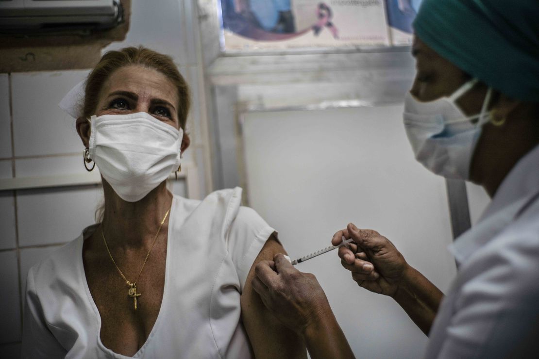 A nurse inoculates a healthcare worker with a dose of the Soberana-02 COVID-19 vaccine, in Havana, Cuba, March 24.