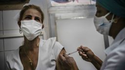 A nurse inoculates a healthcare worker with a dose of the Soberana-02 COVID-19 vaccine, in Havana, Cuba, Wednesday, March 24, 2021. (Ramon Espinosa/Pool Photo via AP)