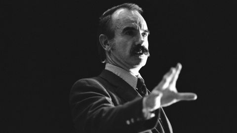 Convicted Watergate conspirator G. Gordon Liddy gestures as he speaks to a capacity audience at Xavier University, Dec. 11, 1980, in Cincinnati. A small group of students demonstrated outside the auditorium prior to Liddy's speech, protesting the use of student funds to pay for his appearance.
