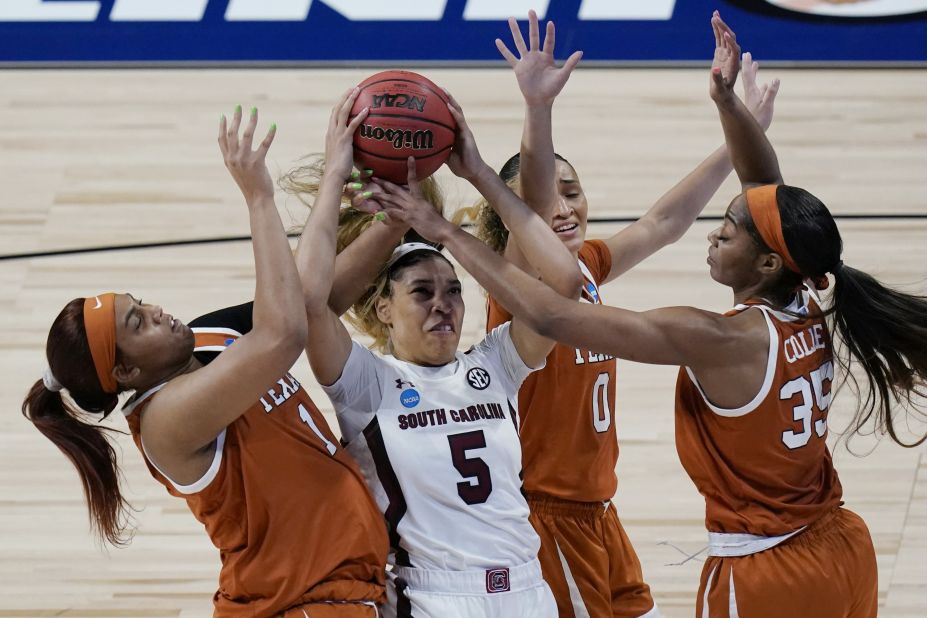 South Carolina forward Victaria Saxton is swarmed by Texas defenders on Tuesday.