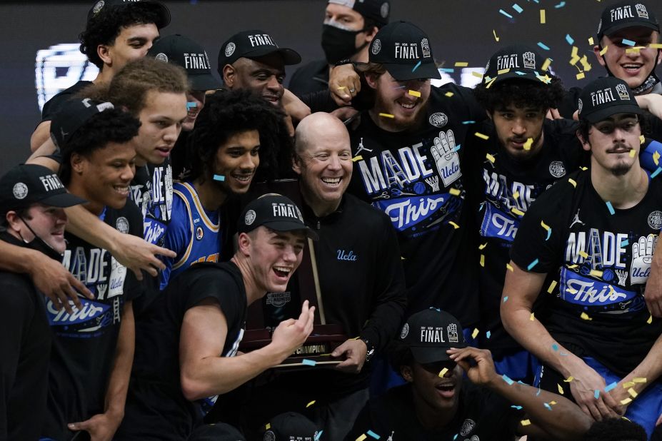 UCLA head coach Mick Cronin celebrates with his team after the Michigan win.