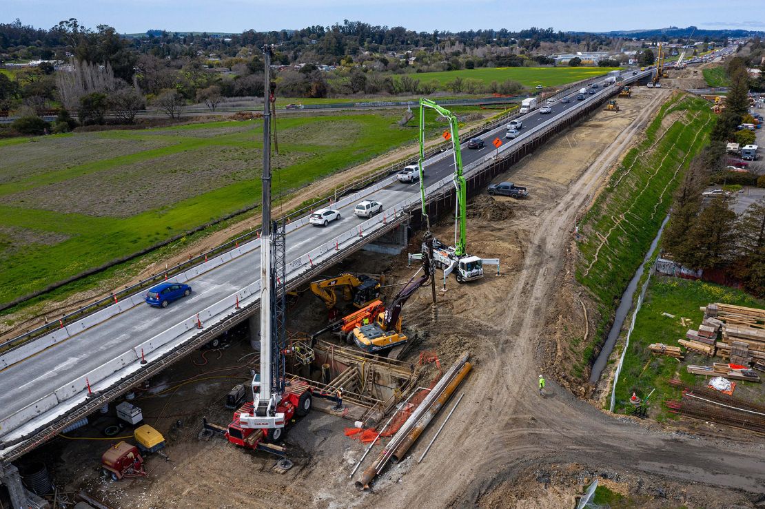 Contractors work on a portion of Highway 101 in Petaluma, California, on March 22. Improving roads and bridges is a key part of Biden's infrastructure plan.