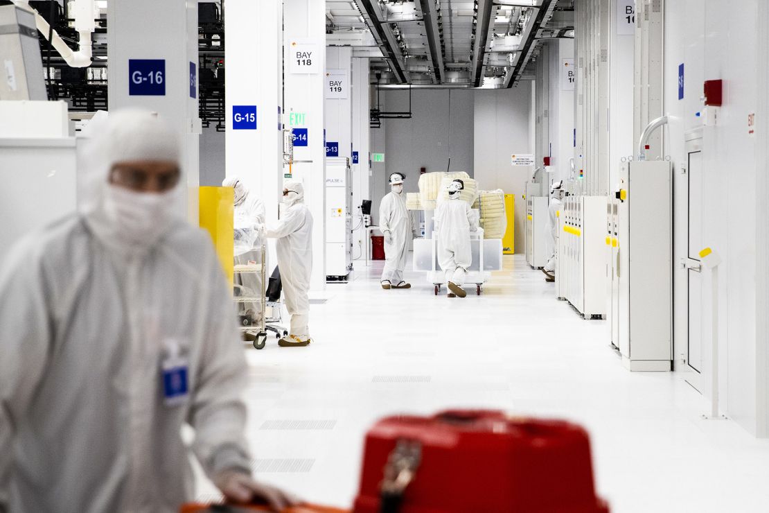 Employees work inside a semiconductor?manufacturing?facility in Malta, New York, on March 16, 2021. Production plants for semiconductors have become a focal point of economic recovery.