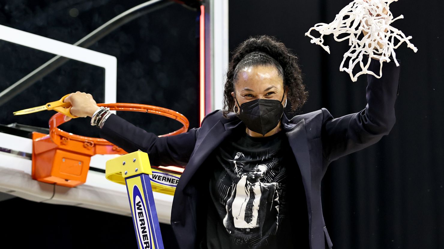 South Carolina head coach Dawn Staley celebrates after cutting the last piece of the net during the Elite Eight round of the NCAA Women's Basketball Tournament.