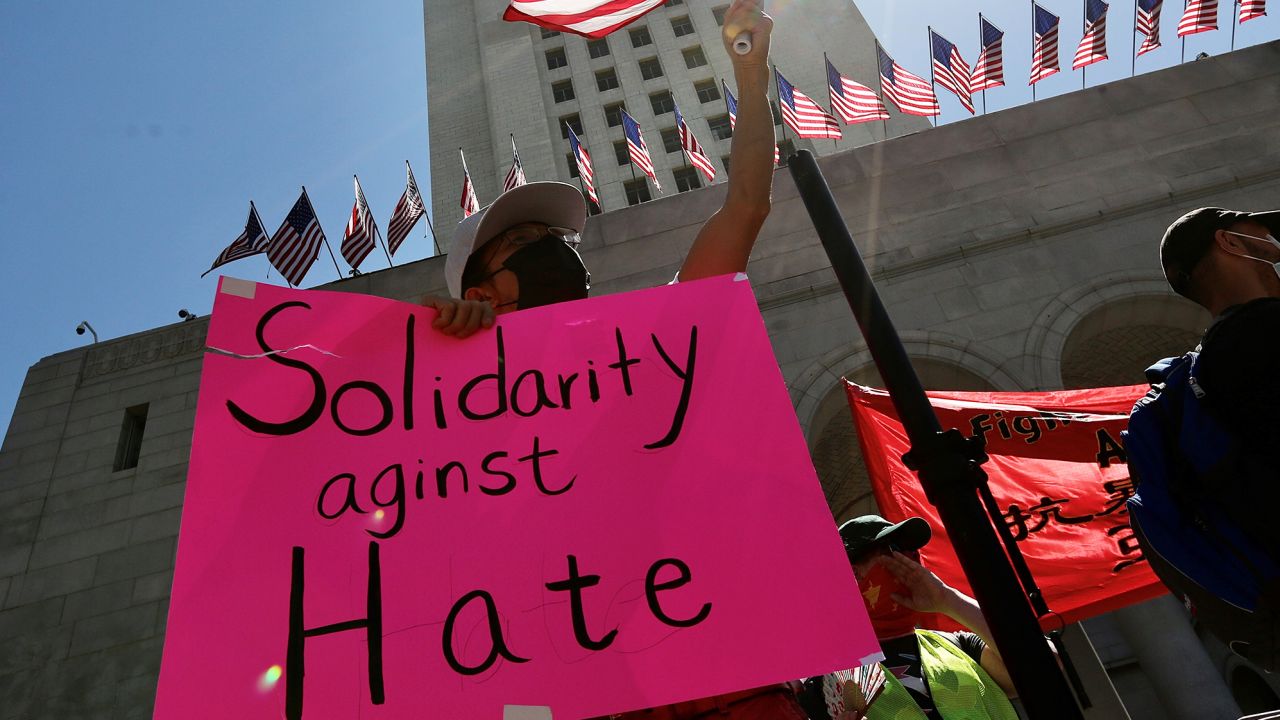 People participate in a Stop Asian Hate rally and march in response to the rising violence against Asian American communities at Los Angeles City Hall, California, the United States March 27, 2021. 