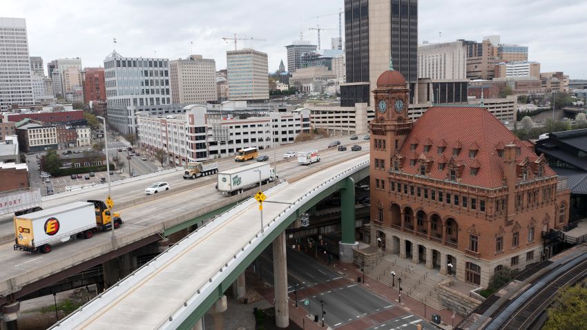 Traffic flows past the Main Street Train Station on the Interstate 95 bridge through downtown Richmond, Va., Wednesday, March 31, 2021.  Looking beyond the $1.9 trillion COVID relief bill, President Joe Biden and lawmakers are laying the groundwork for another of his top legislative priorities — a long-sought boost to the nation's roads, bridges and other infrastructure that could meet GOP resistance to a hefty price tag. (AP Photo/Steve Helber)