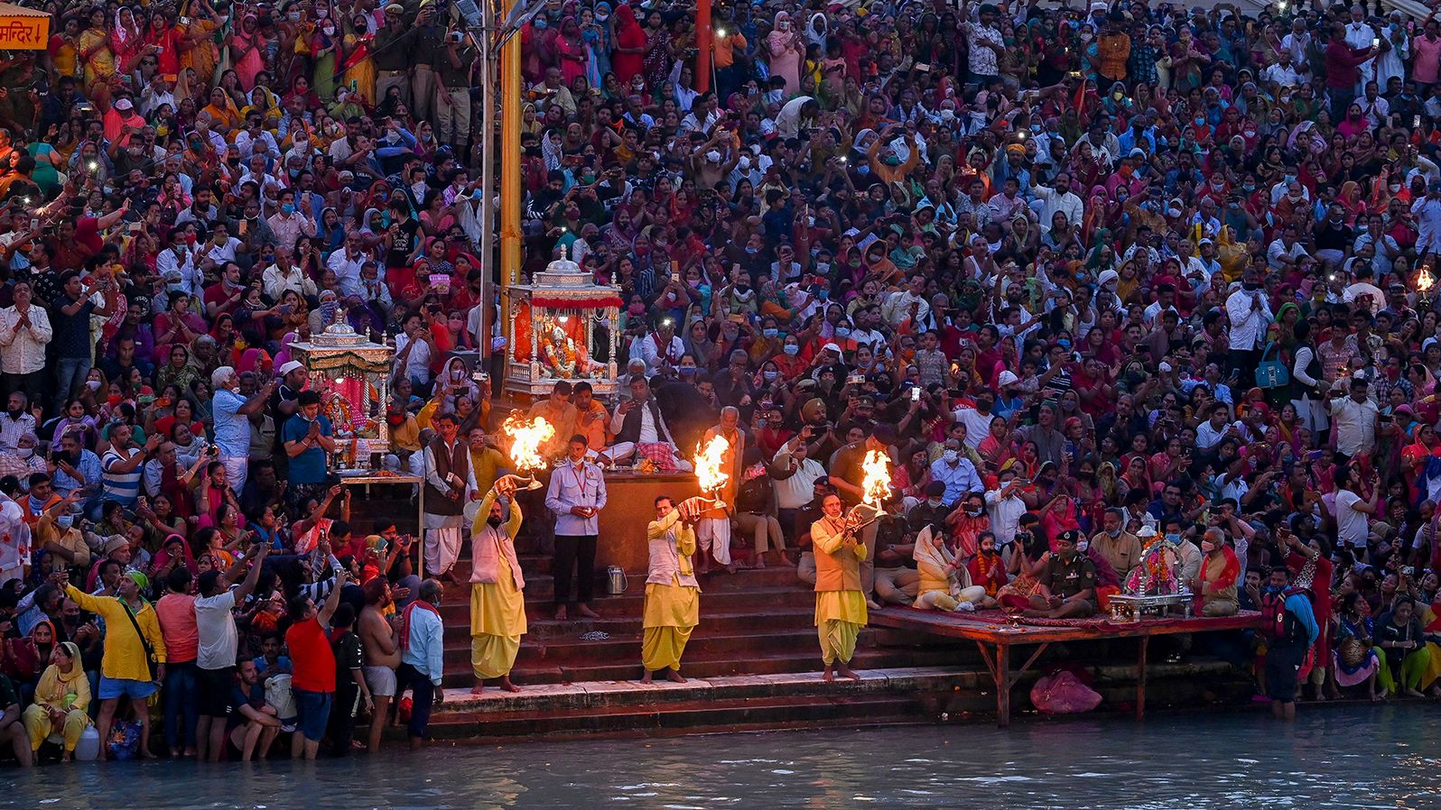 Hindu devotees attend evening prayers during Kumbh Mela in Haridwar on March 11.