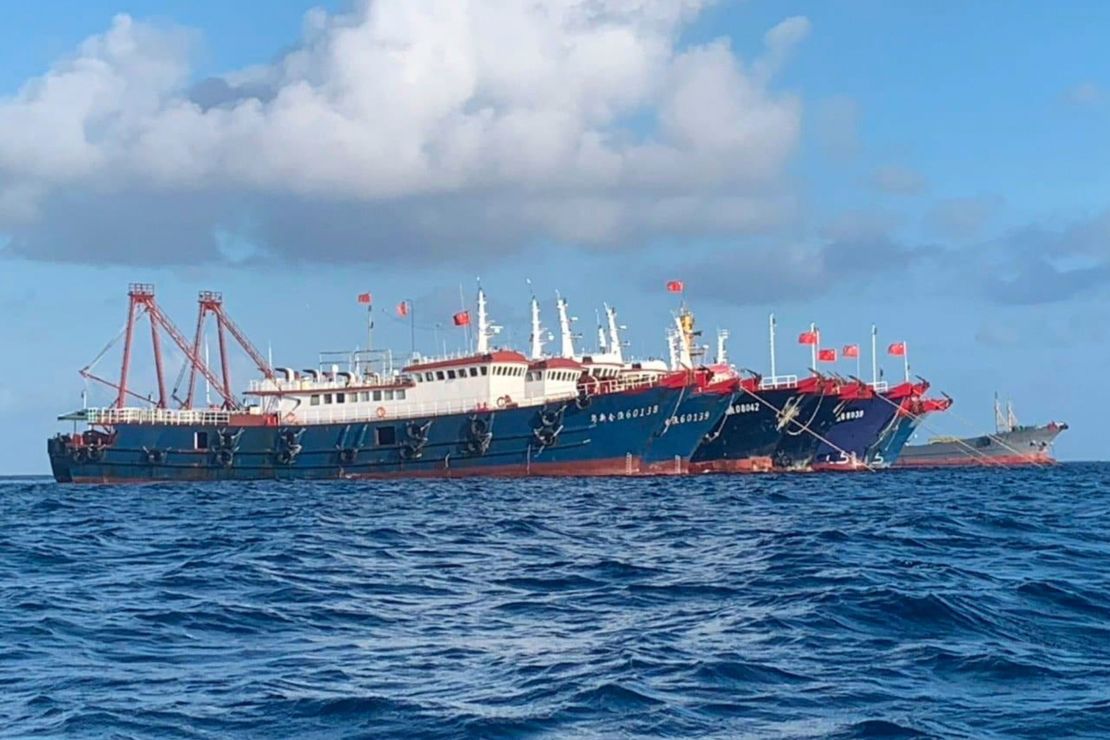 In this photo provided by the National Task Force-West Philippine Sea, Chinese vessels are moored at Whitsun Reef, South China Sea on March 27, 2021.