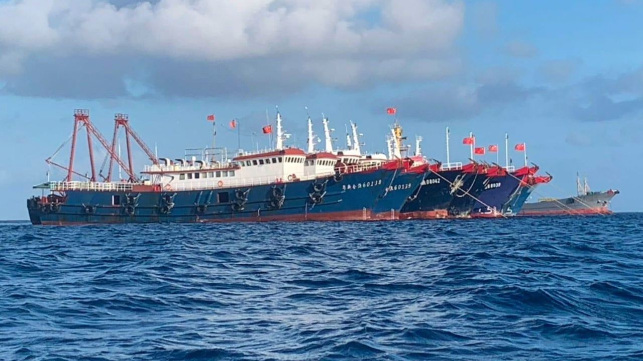 In this photo provided by the National Task Force-West Philippine Sea, Chinese vessels are moored at Whitsun Reef, South China Sea on March 27, 2021.