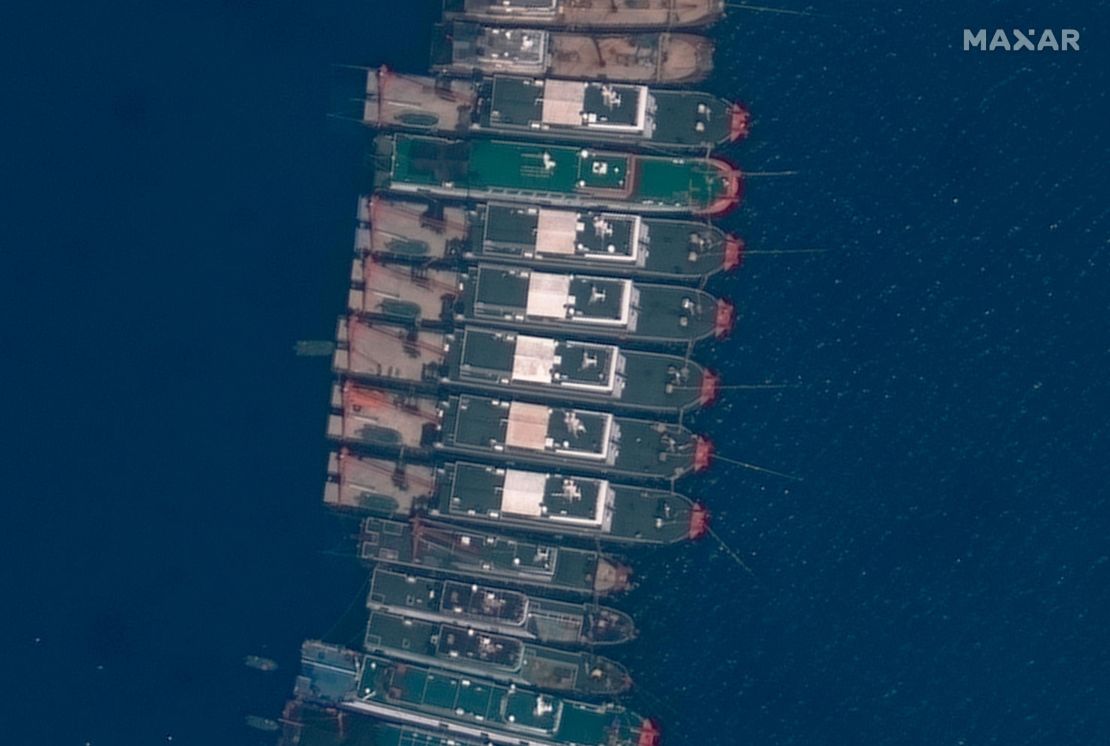 This satellite image provided by Maxar Technologies shows Chinese vessels anchored the Whitsun Reef located in the disputed South China Sea. Tuesday, March 23, 2021. 