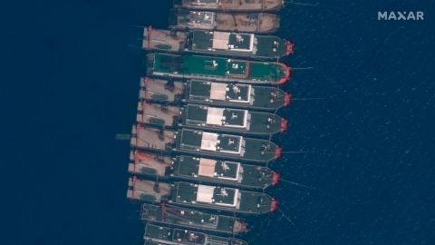 This satellite image provided by Maxar Technologies shows Chinese vessels anchored the Whitsun Reef located in the disputed South China Sea. Tuesday, March 23, 2021. 