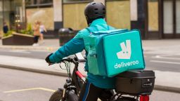 Mandatory Credit: Photo by Pietro Recchia/SOPA Images/Shutterstock (11839820c)
Deliveroo courier rides along Regent Street delivering Takeaway food  in central London.
Deliveroo rider in London, UK - 31 Mar 2021