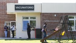 EL PALOMAR, ARGENTINA - FEBRUARY 18: People wait outside a vaccination center, where the Sputnik V vaccine is being applied during the first stage of the mass vaccination campaign against COVID-19 at Hospital Posadas on February 18, 2021 in El Palomar, Buenos Aires province, Argentina. According to the Argentine Health Ministry, more than 600,000 doses have already been administered. (Photo by Marcos Brindicci/Getty Images)