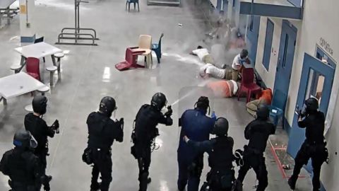 In this image from video surveillance footage, provided by La Palma Correctional Center staff and released in the DHS report, LPCC staff are seen firing pepper spray and chemical agents at detainees in an LPCC housing area on April 13, 2020. 