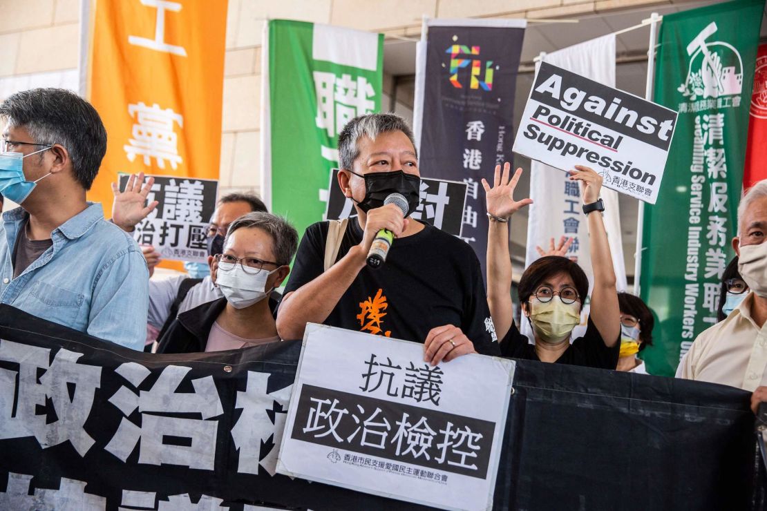 Pro-democracy activist Lee Cheuk-yan (C) speaks to the media outside West Kowloon Court in Hong Kong on April 1, 2021.