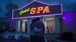 Cynthia Shi and her boyfriend, Graham Bloomsmith, embrace outside Gold Spa near Acworth, Ga., on Thursday, March 18, 2021, one of three massage businesses where eight people were killed and another injured by a shooter on Tuesday. The Atlanta area shootings, in which six women of Asian descent were killed, come amid a tortured public conversation over how to confront a rise in reports of violence against Asian-Americans, who have felt increasingly vulnerable with each new attack. (Chang W. Lee/The New York Times)